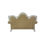 Divanetto capitonné con cornice intagliata e cuscini decorativi